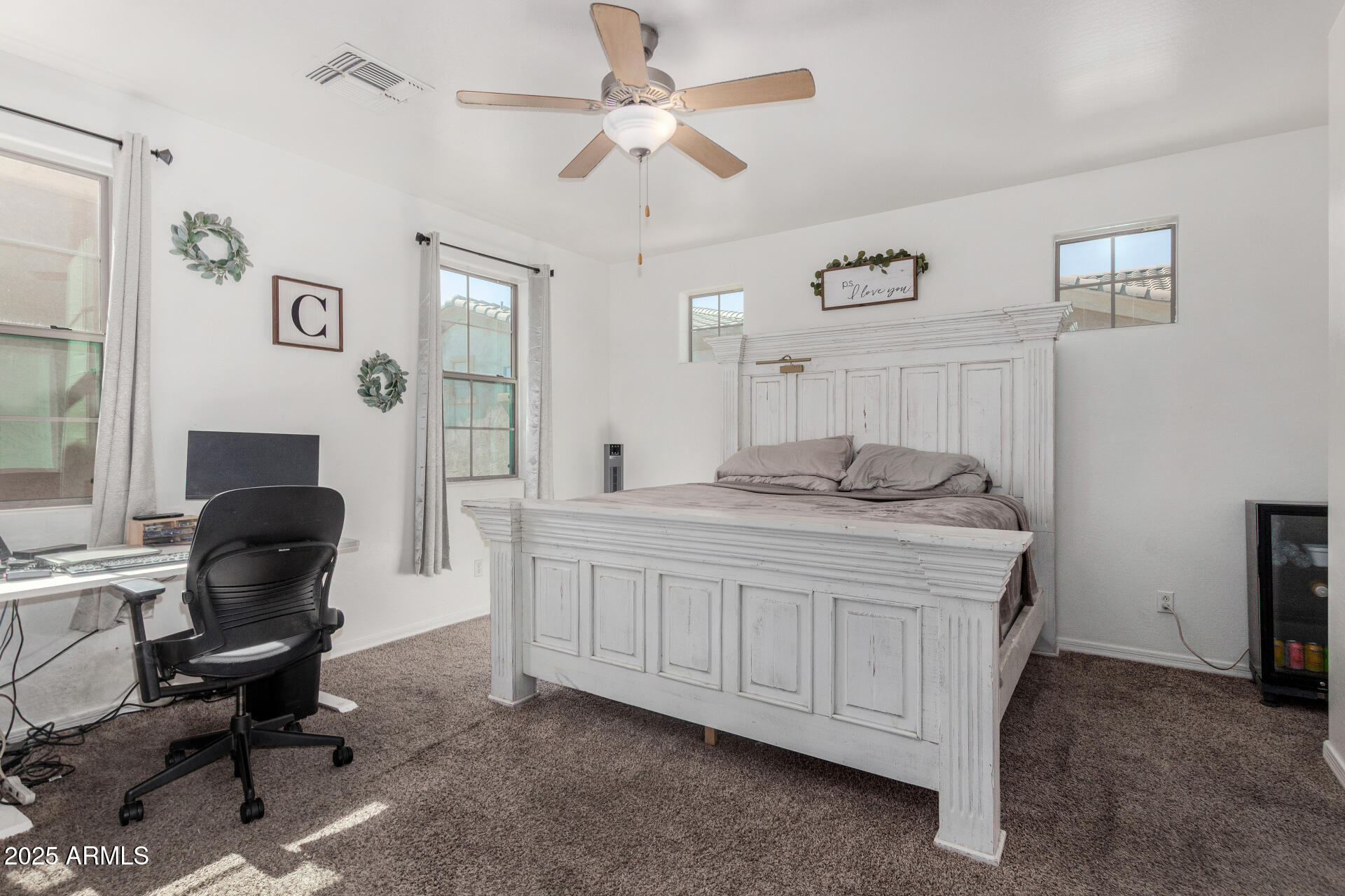 1732 South Desert View Place Apache Junction, AZ 85120 - Photo 7 of 15 a bedroom with a bed a chair and a chandelier