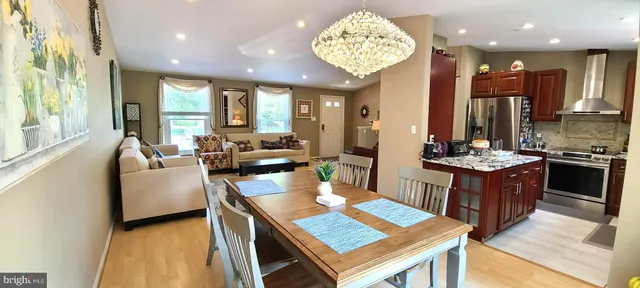 a kitchen with a table and chairs in it