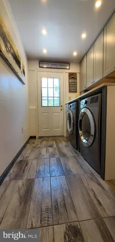 a view of a storage & utility room with wooden floor