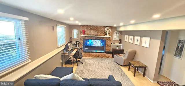 a view of a livingroom with furniture and a flat screen tv