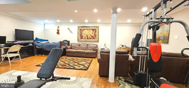 a living room with furniture projector and a flat screen tv
