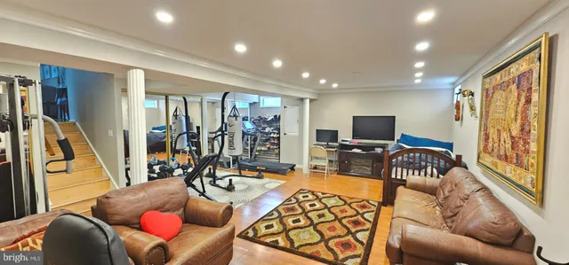 a view of a livingroom with furniture and a flat screen tv