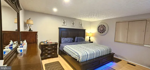 a bedroom with a bed and a table in it