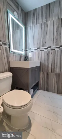 a bathroom with a toilet and a sink