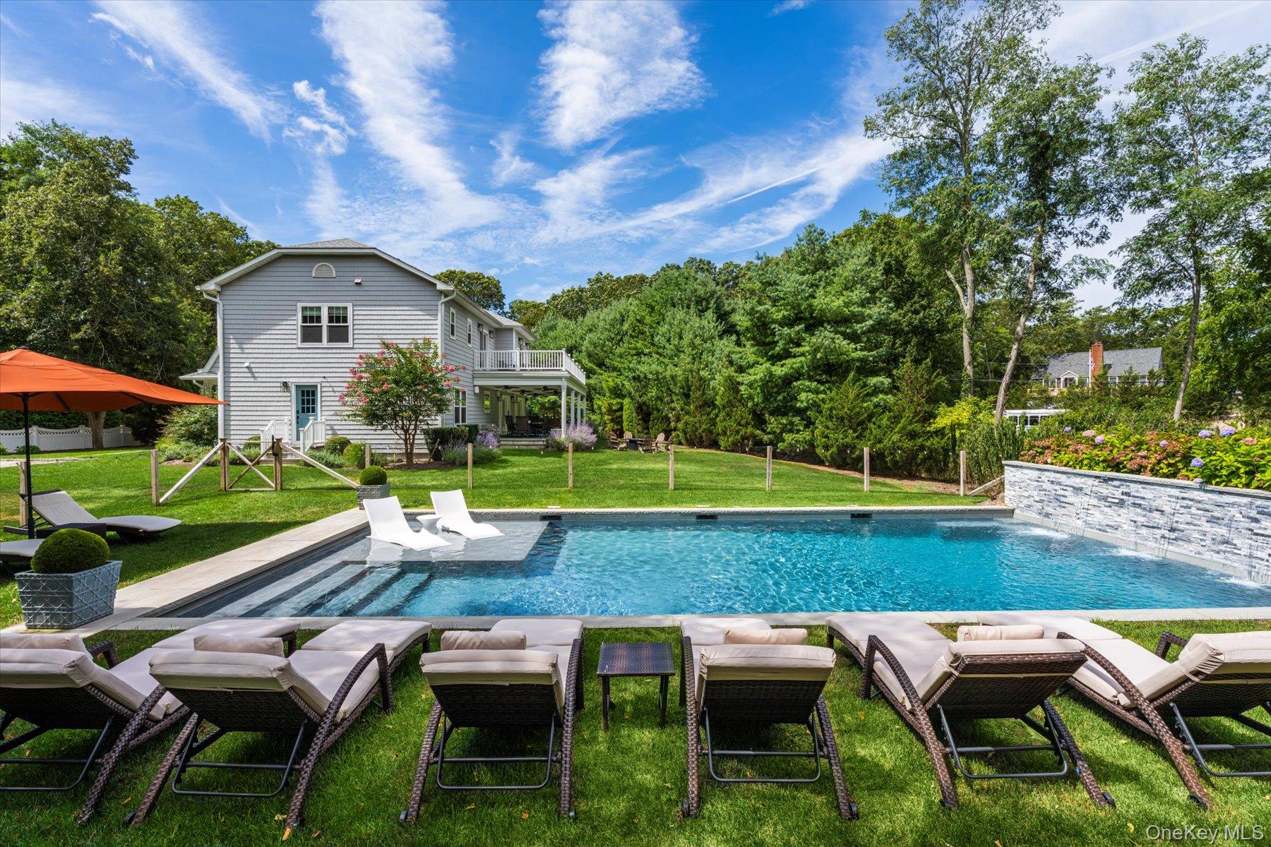 45 Old Sag Harbor Road Southampton, NY 11968 - Photo 12 of 47 a view of house with backyard and outdoor seating