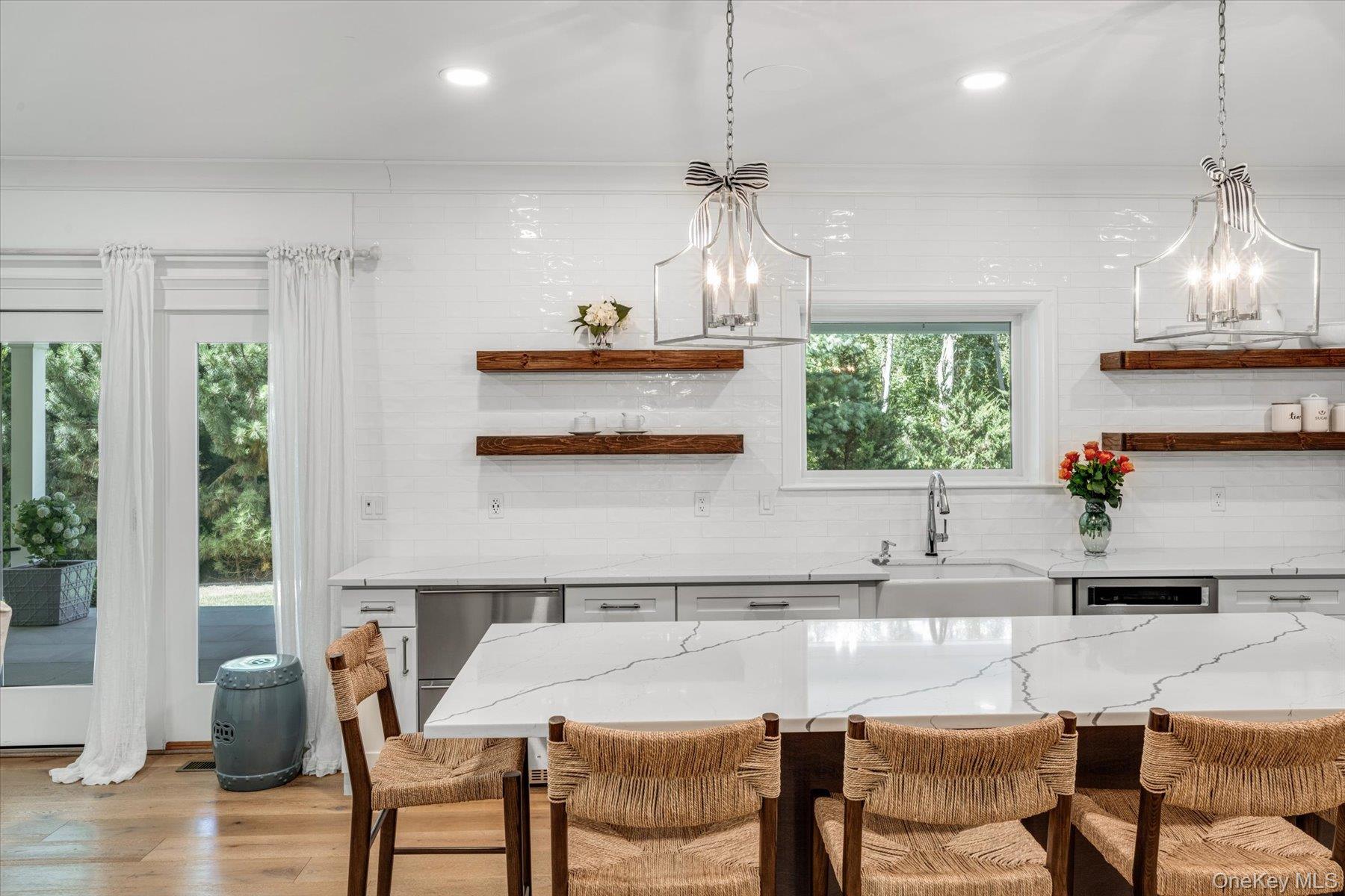 45 Old Sag Harbor Road Southampton, NY 11968 - Photo 17 of 47 a kitchen with a table and chairs in it