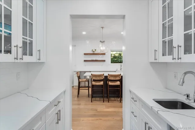 a bedroom with a large bed and a fireplace