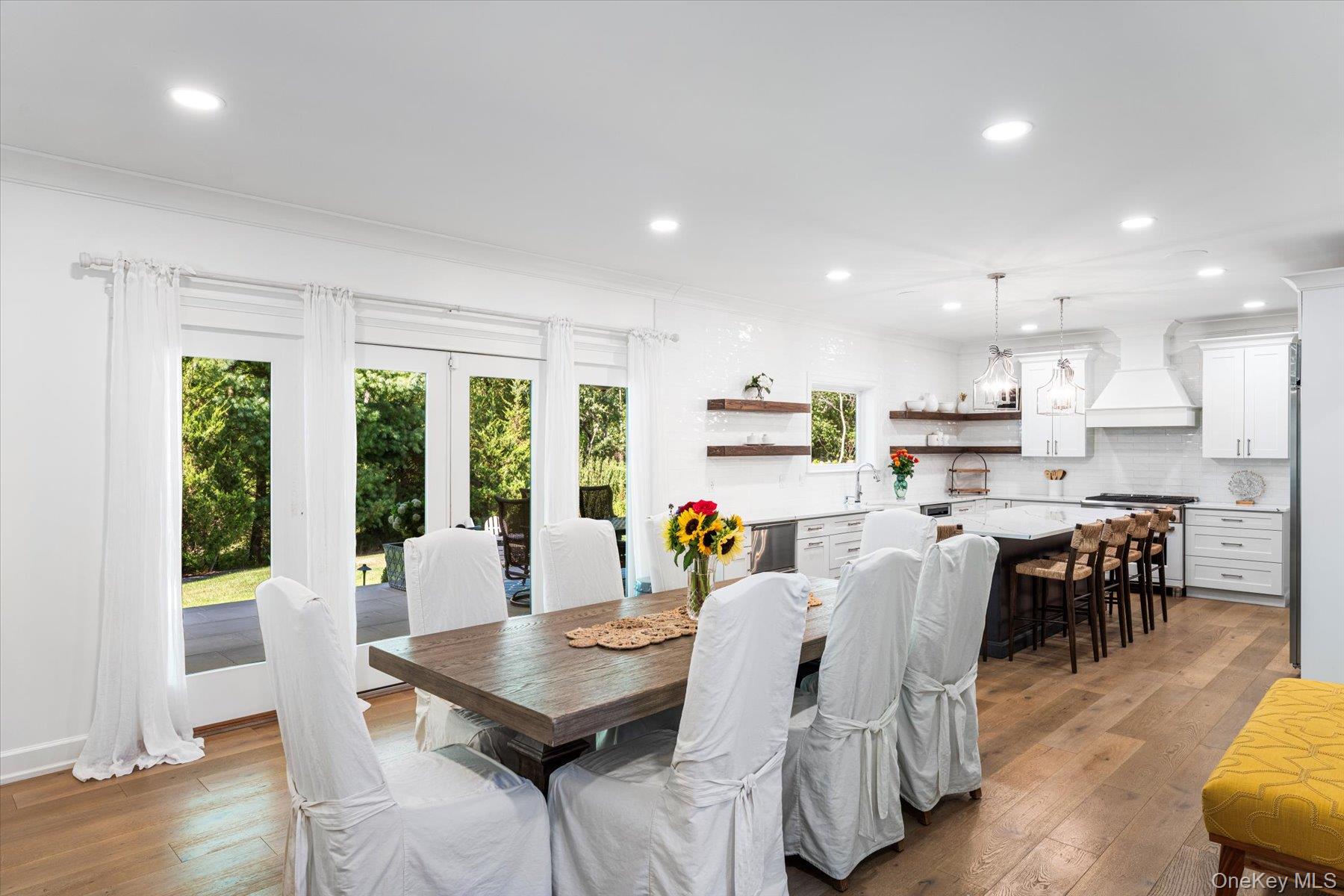 45 Old Sag Harbor Road Southampton, NY 11968 - Photo 21 of 47 a view of a dining room with furniture and wooden floor