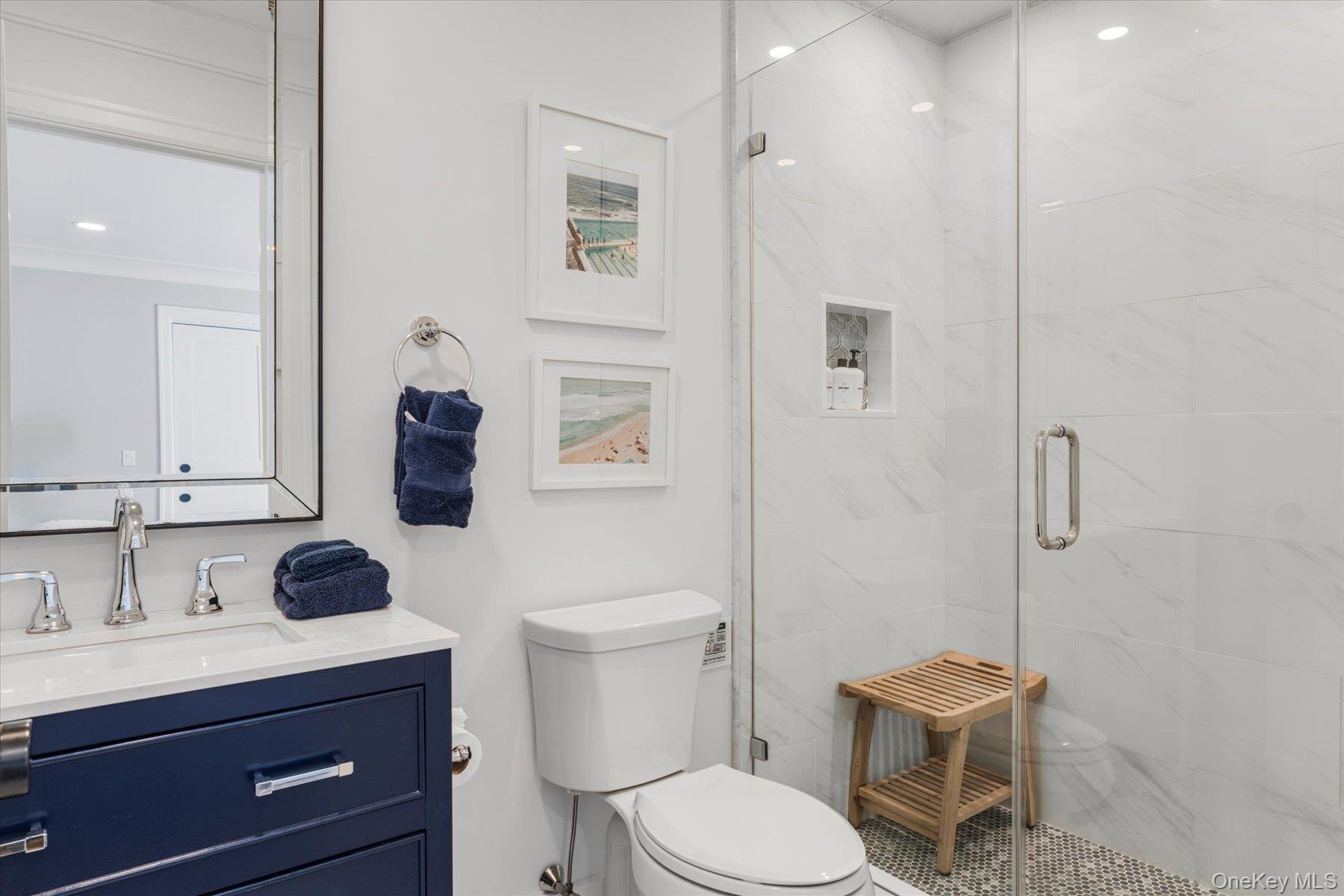 45 Old Sag Harbor Road Southampton, NY 11968 - Photo 35 of 47 a bathroom with a sink toilet a vanity and shower