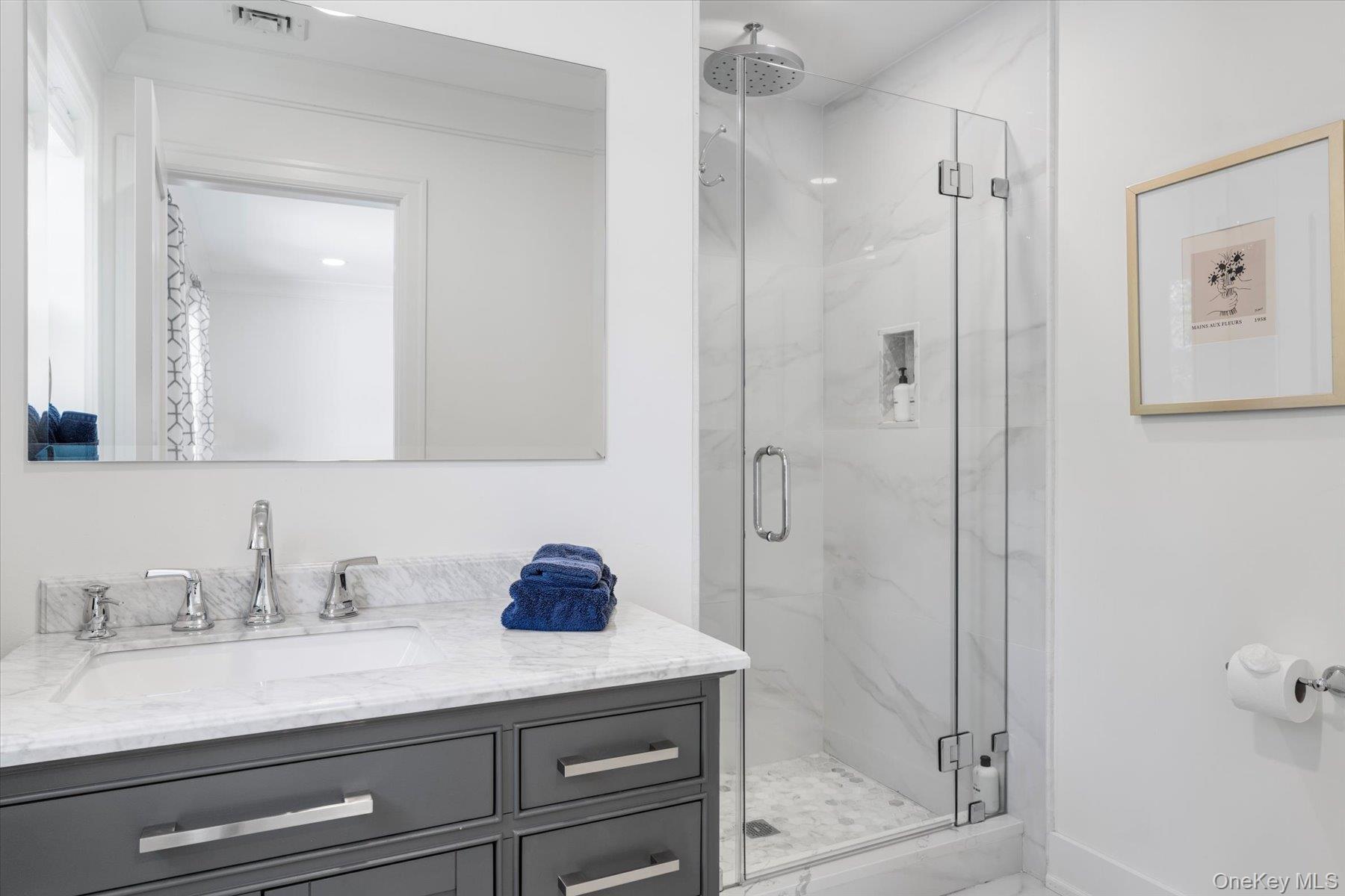 45 Old Sag Harbor Road Southampton, NY 11968 - Photo 41 of 47 a bathroom with a granite countertop sink mirror and shower