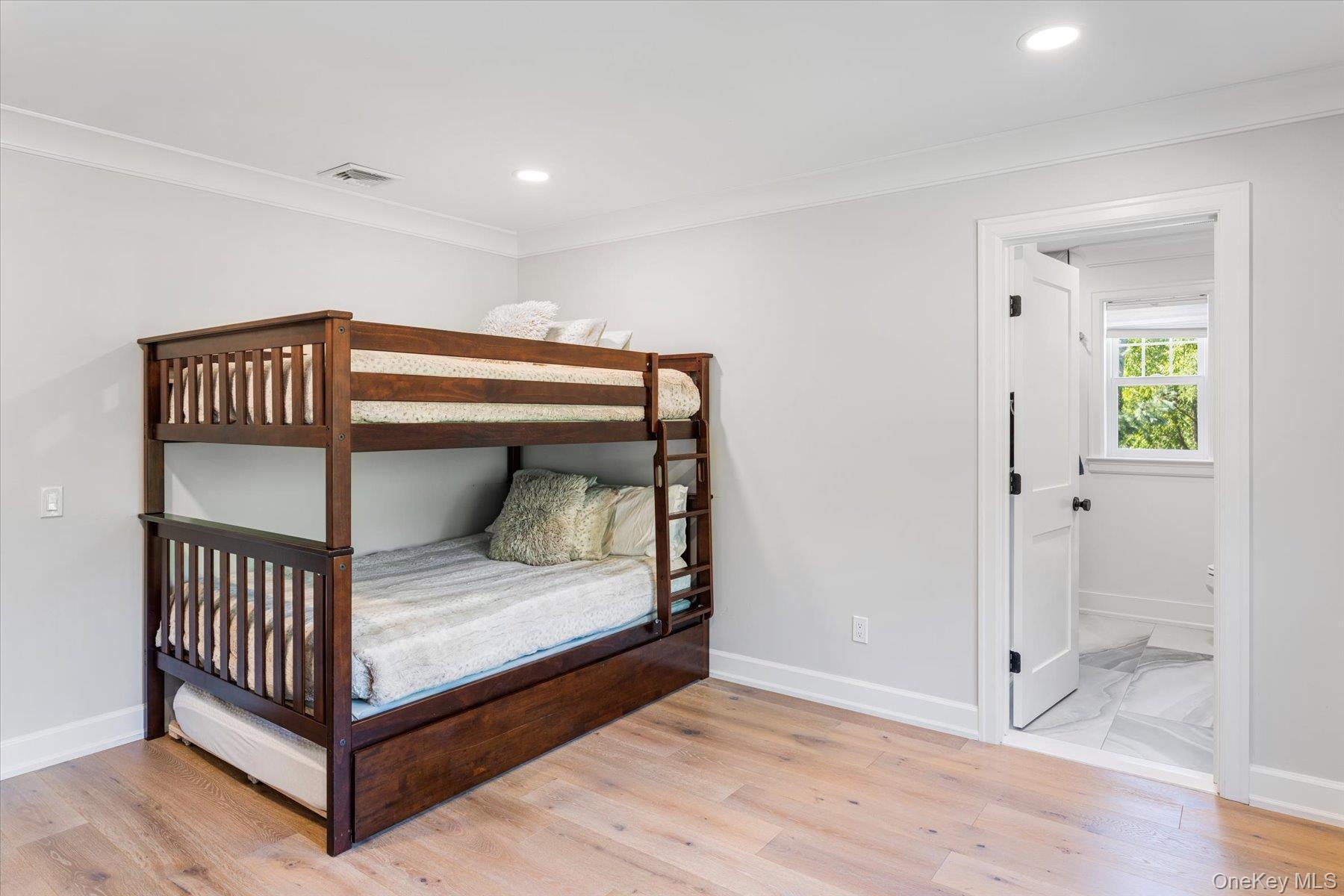 45 Old Sag Harbor Road Southampton, NY 11968 - Photo 42 of 47 a bedroom with a bed and a window