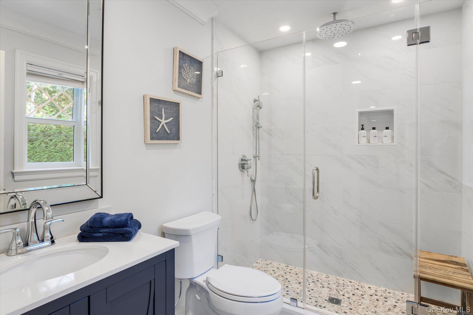 45 Old Sag Harbor Road Southampton, NY 11968 - Photo 43 of 47 a bathroom with a sink a toilet and shower