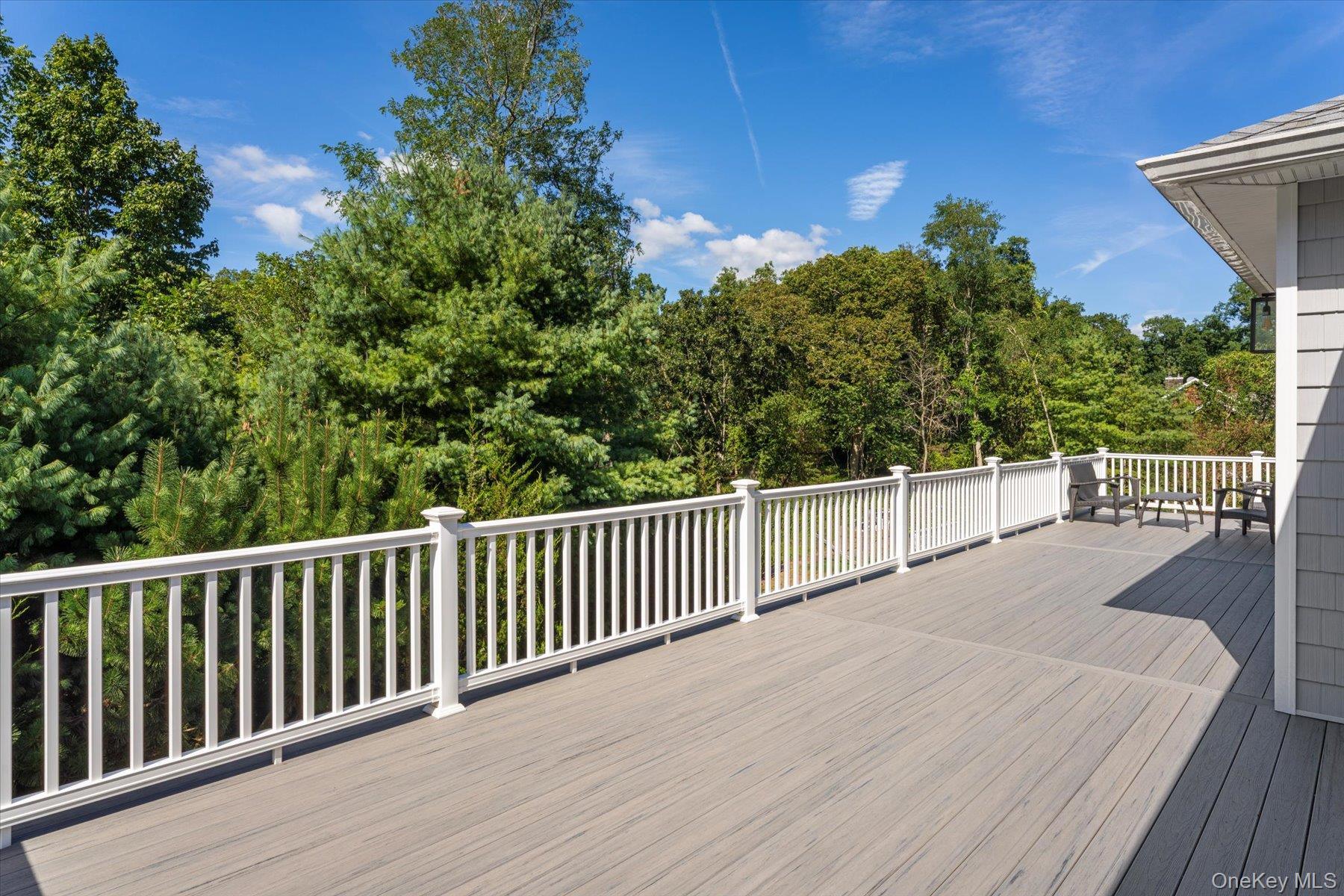 45 Old Sag Harbor Road Southampton, NY 11968 - Photo 46 of 47 a view of a balcony with wooden floor and fence