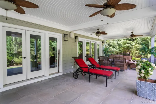 a view of a backyard with sitting area