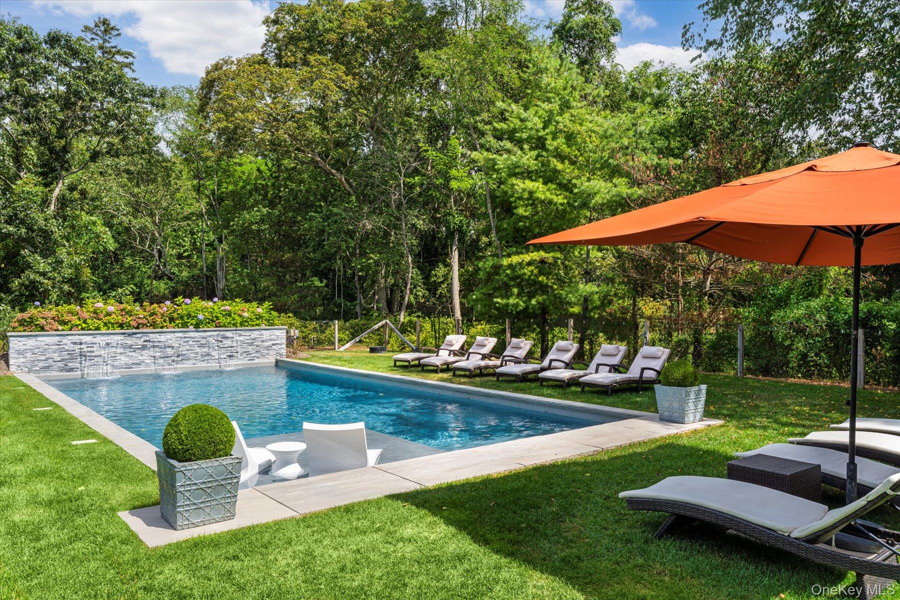 45 Old Sag Harbor Road Southampton, NY 11968 - Photo 10 of 47 a view of a backyard with sitting area