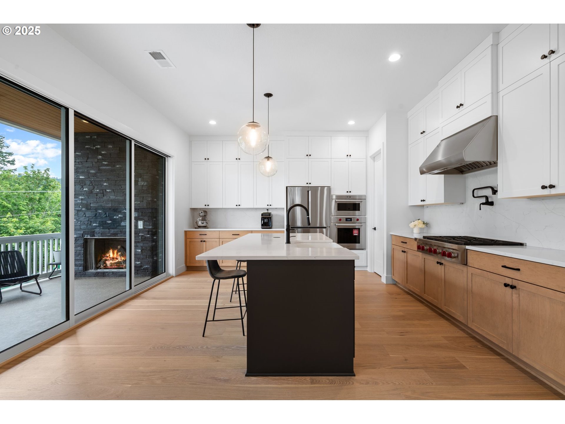 15625 Northwest Gooderham Street Portland, OR 97229 - Photo 14 of 45 a open kitchen with stainless steel appliances granite countertop a sink a stove and a refrigerator