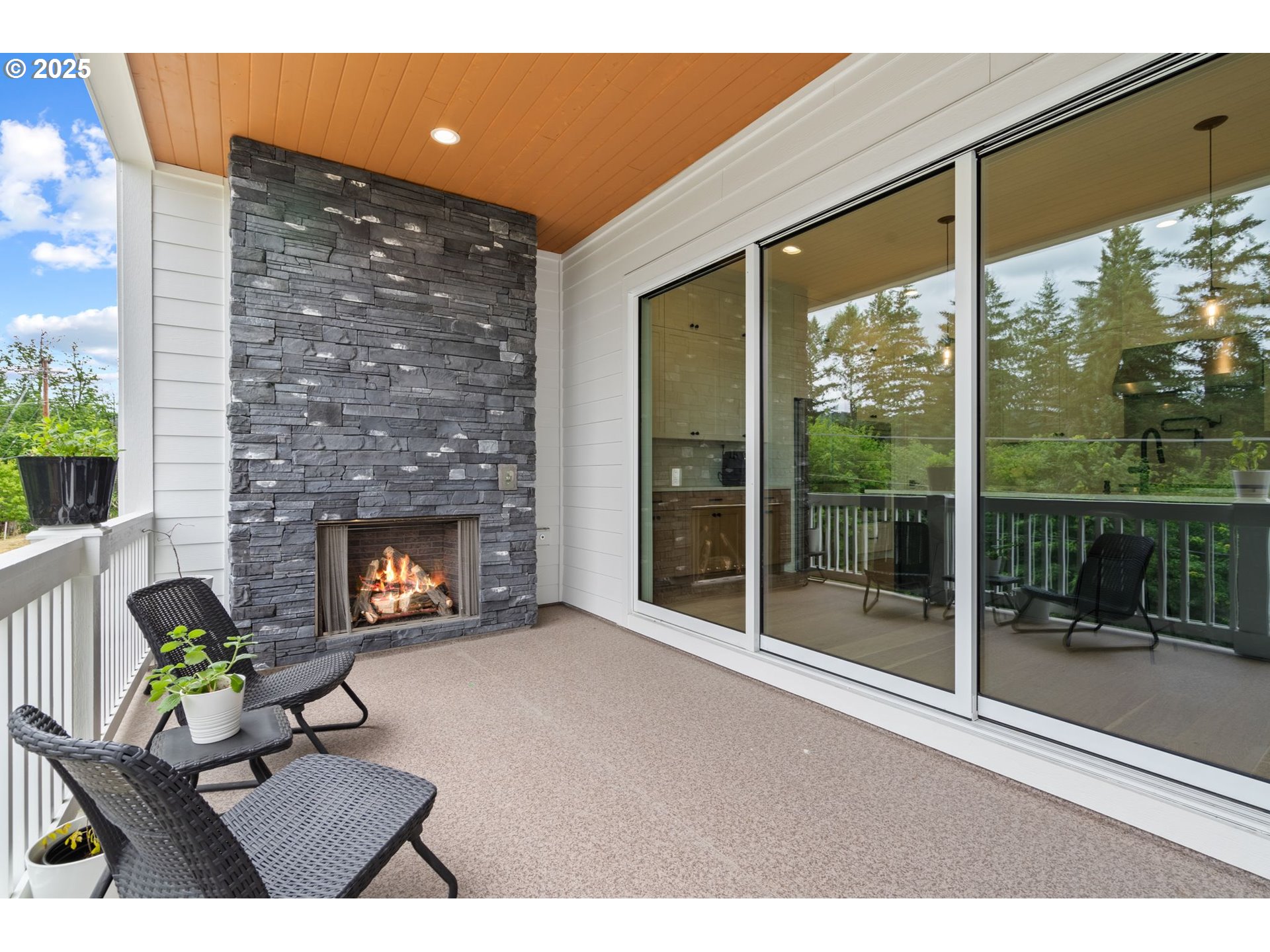 15625 Northwest Gooderham Street Portland, OR 97229 - Photo 20 of 45 a living room with furniture and a fireplace