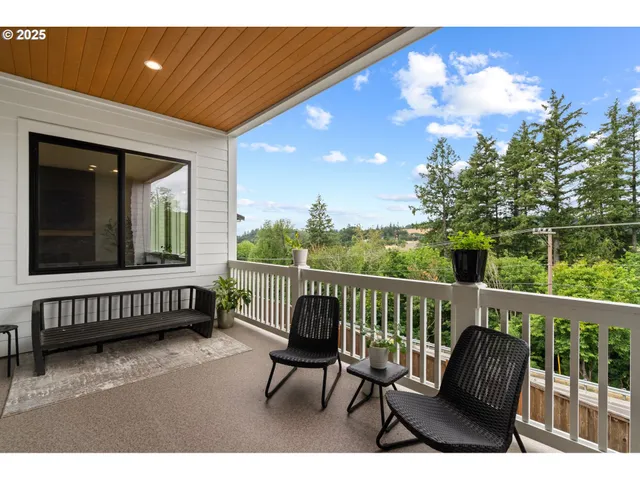 a view of a chair and table in the balcony