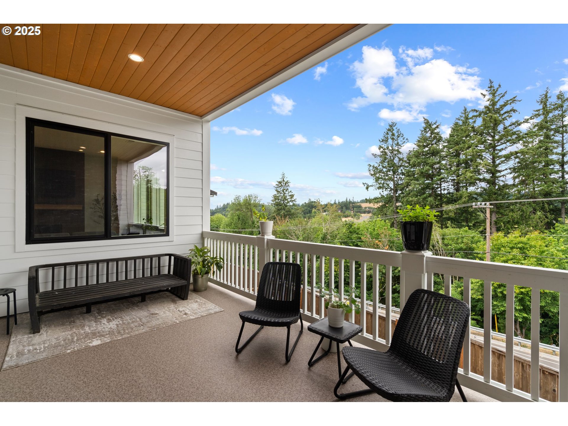 15625 Northwest Gooderham Street Portland, OR 97229 - Photo 21 of 45 a view of a chair and table in the balcony