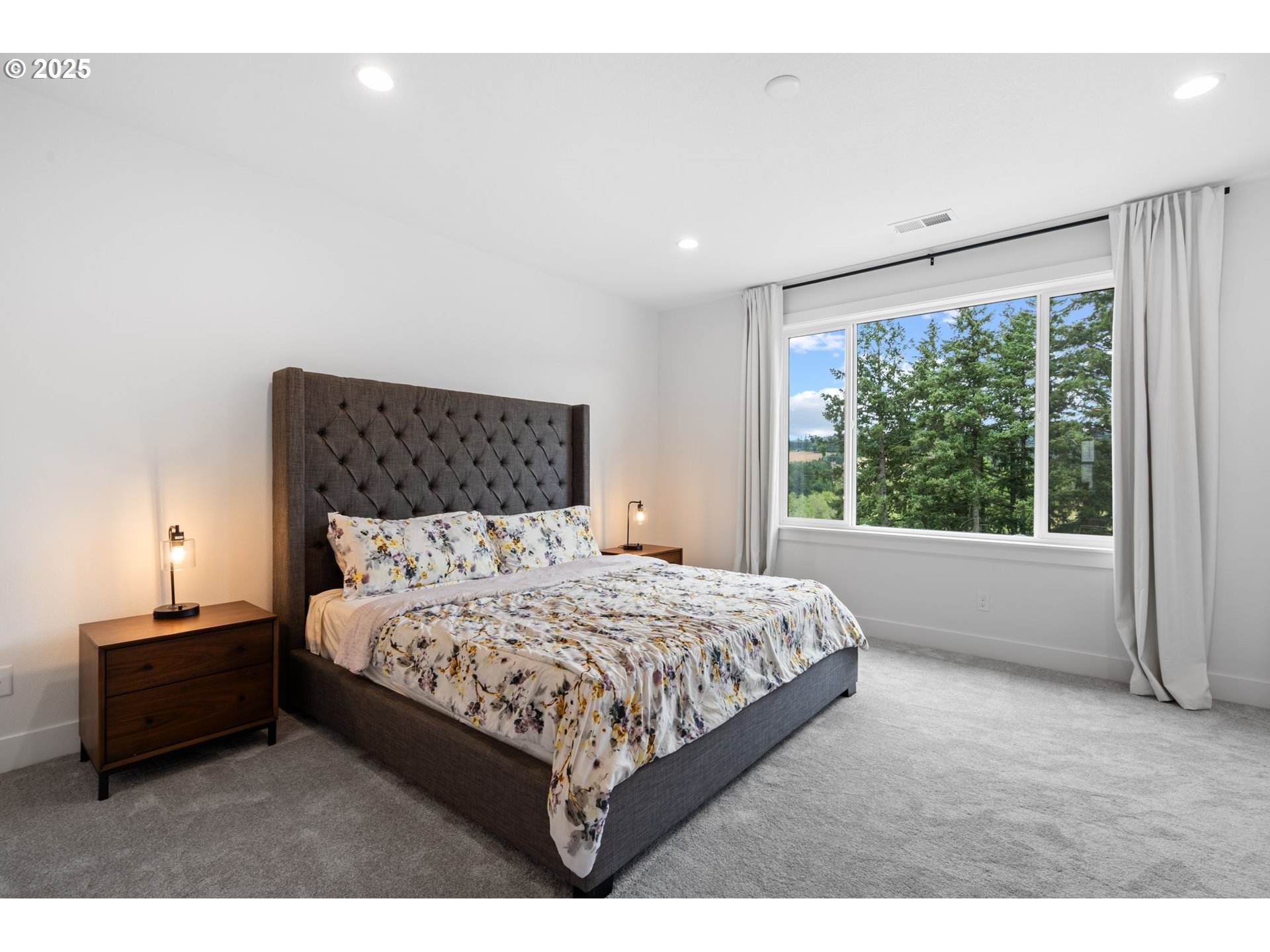 15625 Northwest Gooderham Street Portland, OR 97229 - Photo 25 of 45 a bedroom with a bed and a window