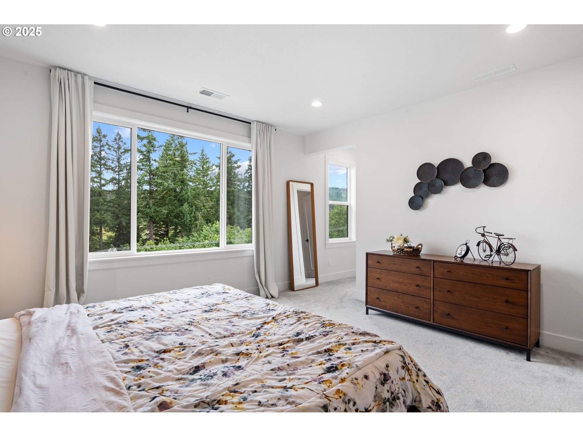15625 Northwest Gooderham Street Portland, OR 97229 - Photo 26 of 45 a bedroom with a bed dresser and a large window