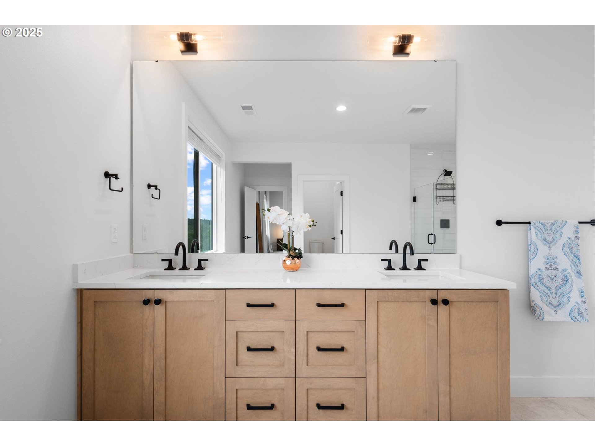 15625 Northwest Gooderham Street Portland, OR 97229 - Photo 28 of 45 a bathroom with a sink a vanity and a mirror