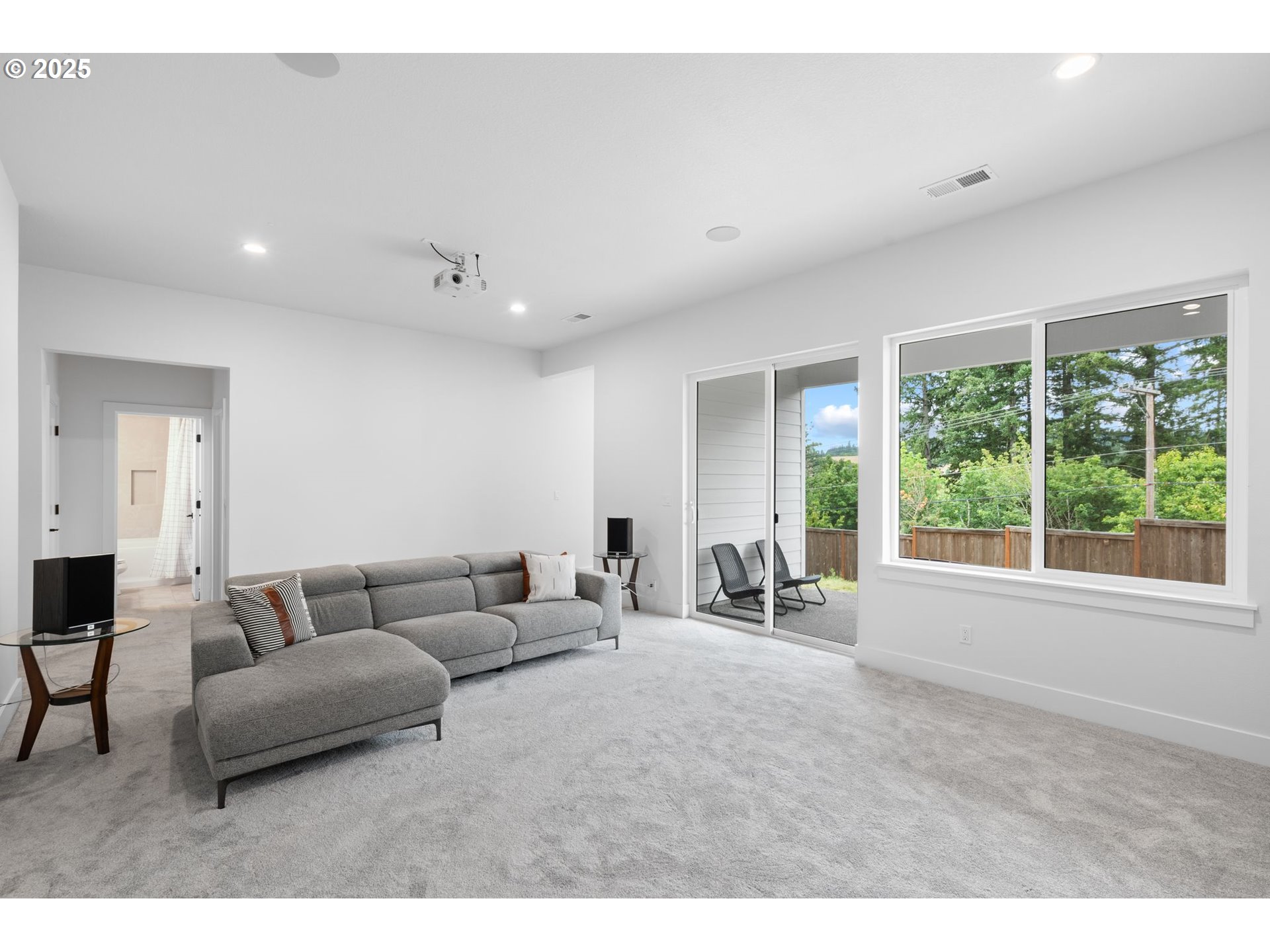 15625 Northwest Gooderham Street Portland, OR 97229 - Photo 37 of 45 a living room with furniture and a large window