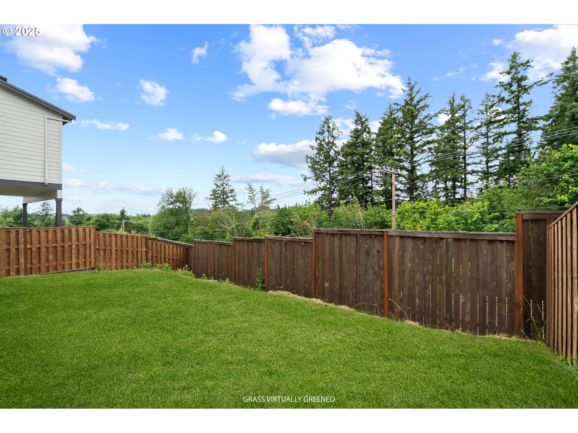 15625 Northwest Gooderham Street Portland, OR 97229 - Photo 42 of 45 a view of a backyard with a chair and wooden fence