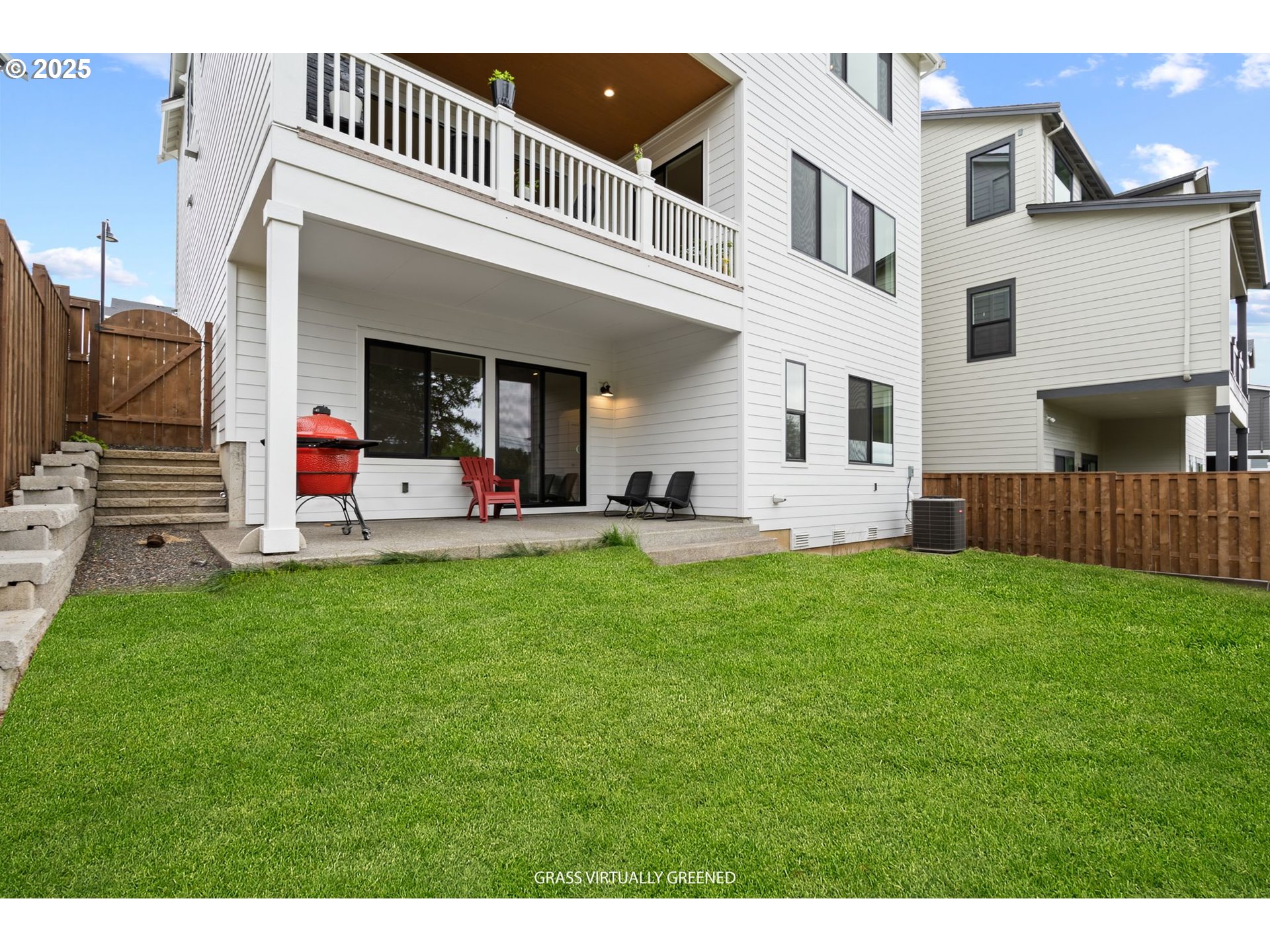 15625 Northwest Gooderham Street Portland, OR 97229 - Photo 43 of 45 a front view of a house with a yard fire pit and outdoor seating