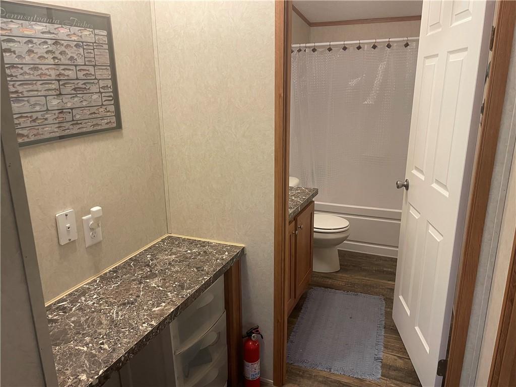 14624 Gilliland Road Linesville, PA 16424 - Photo 23 of 23 a view of a bathroom with a sink and toilet