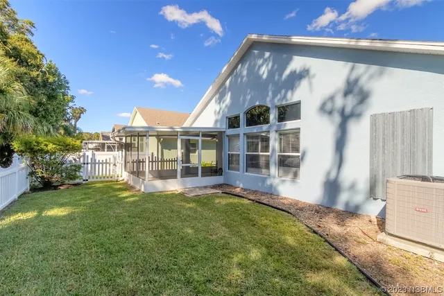 a view of front door and small yard