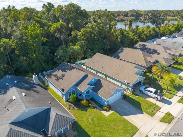 an aerial view of a house with a garden