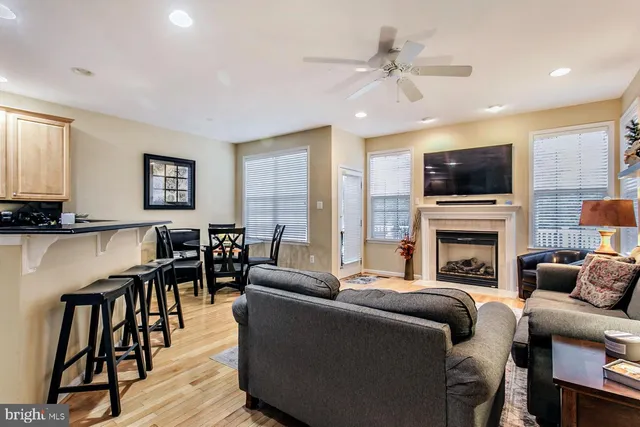 a living room with fireplace furniture and a flat screen tv
