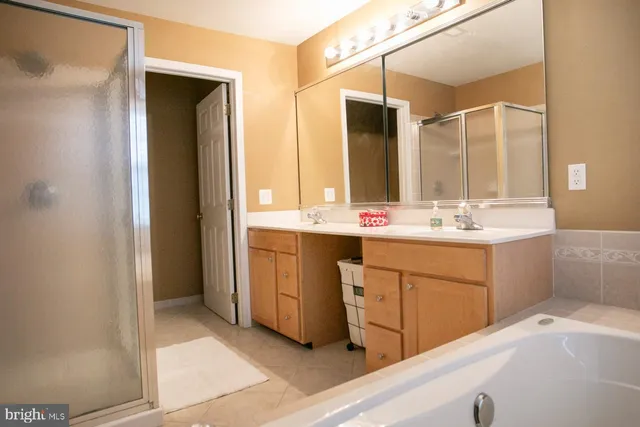 a bathroom with a sink double vanity and a mirror