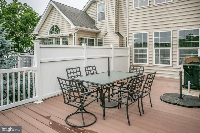 a view of a house with patio and wooden floor