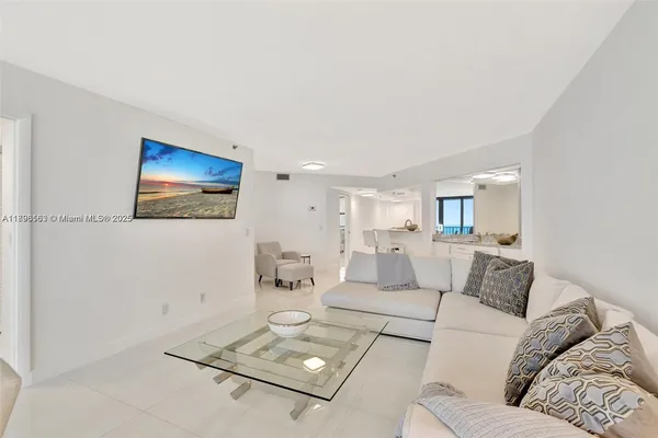 a living room with furniture and a table