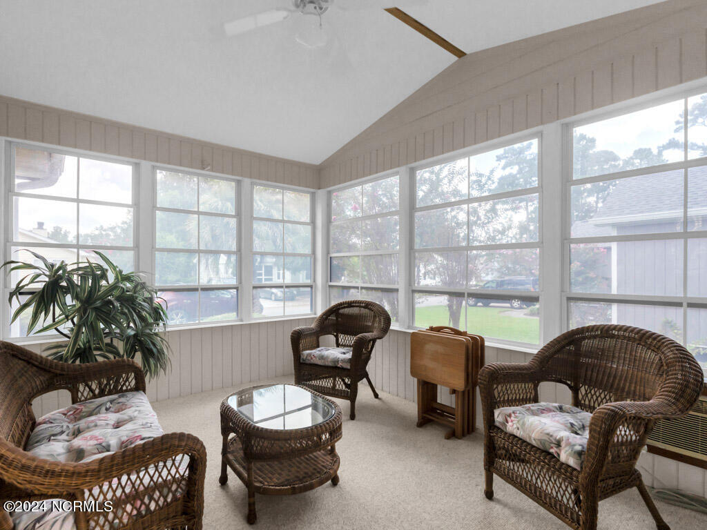 417 Deer Path Calabash, NC 28467 - Photo 15 of 32 The Sun Room, with its advantageous location, natural illumination, and access to an open side deck, becomes a harmonious blend of indoor and outdoor living.