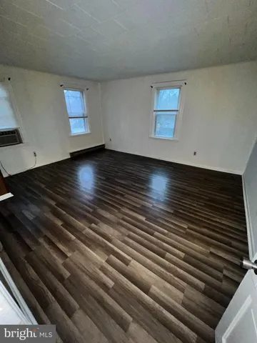 a view of room with hardwood floor