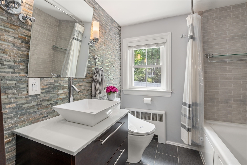 57 Marlboro Road Sudbury, MA 01776 - Photo 20 of 40 a bathroom with a sink toilet and shower