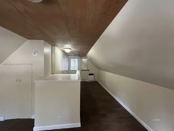 a view of a hallway with staircase
