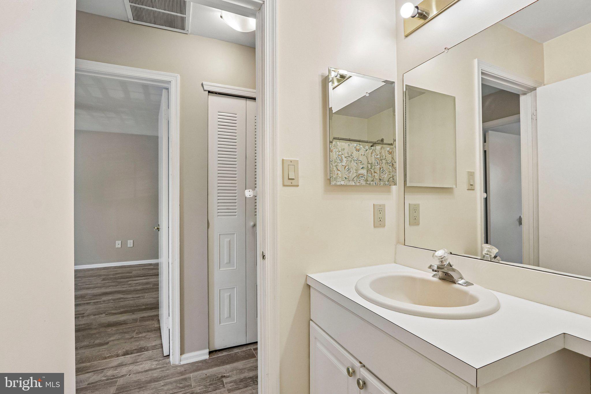 803 Wharton Road Mount Laurel, NJ 08054 - Photo 30 of 48 a bathroom with a sink and a mirror