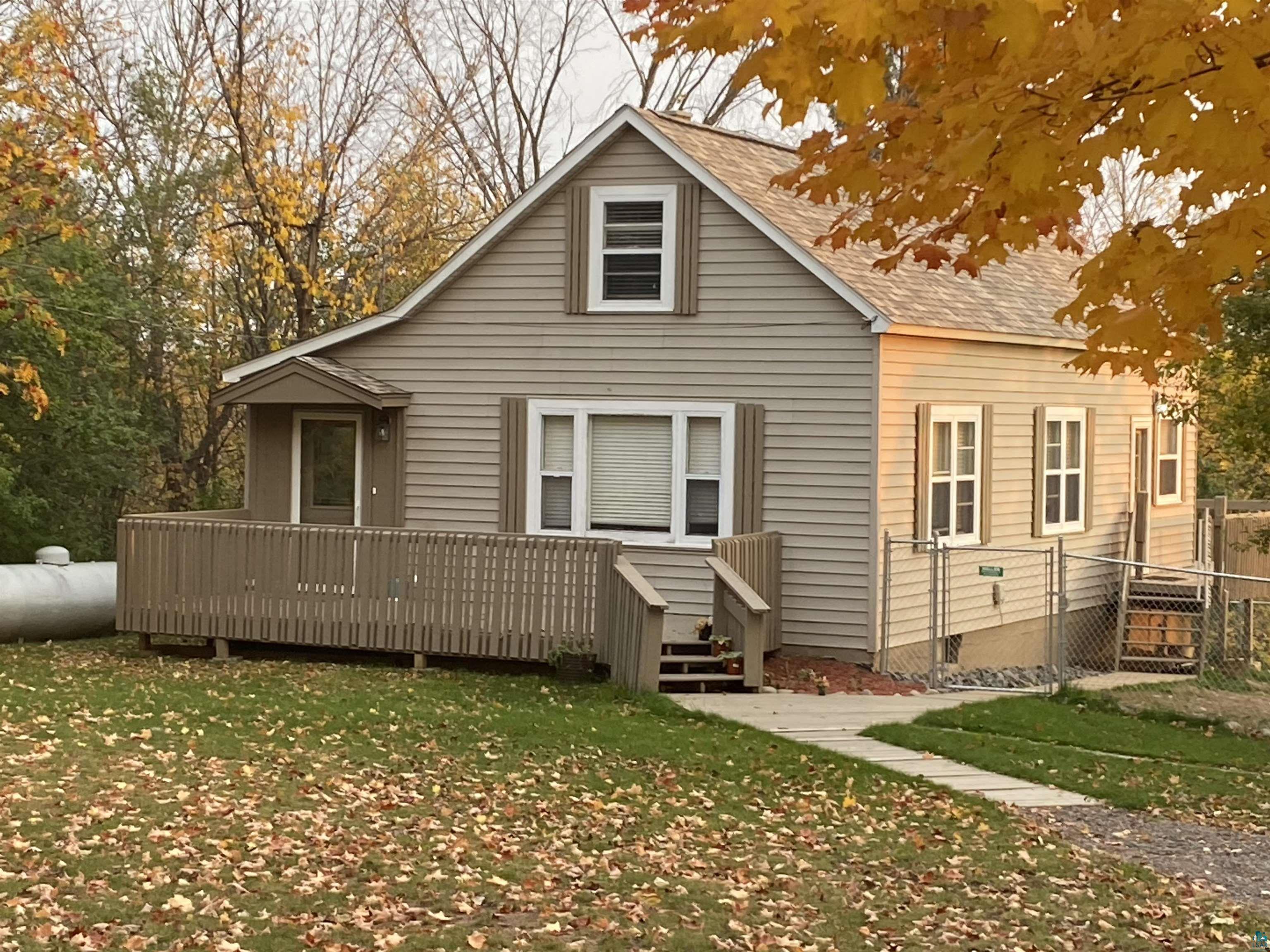 3864 Nelson Road Duluth, MN 55803 - Photo 1 of 16 Front of house with front deck & autumn maples