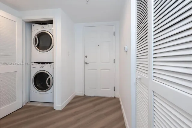 a view of a hallway with washer and dryer