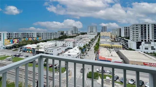 a view of a balcony with furniture