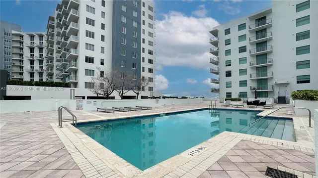 a view of a swimming pool and outdoor space
