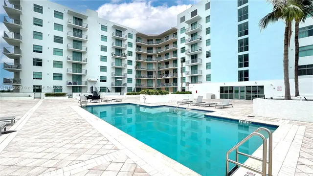 a swimming pool with a outdoor seating