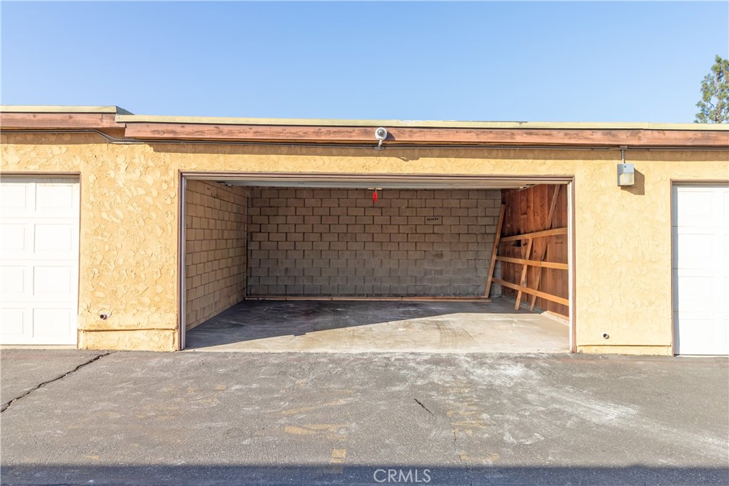 435 West 9th, Unit F5 Upland, CA 91786 - Photo 20 of 23 a view of garage with door