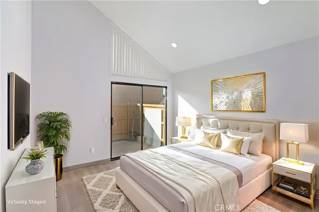 a bedroom with a bed and a potted plant