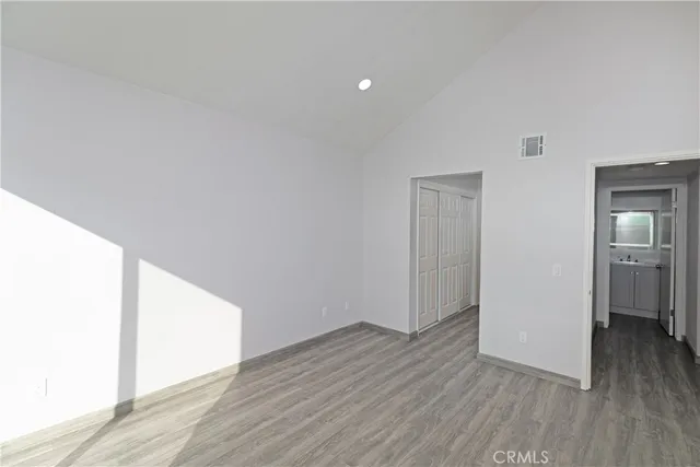 a view of hallway with wooden floor