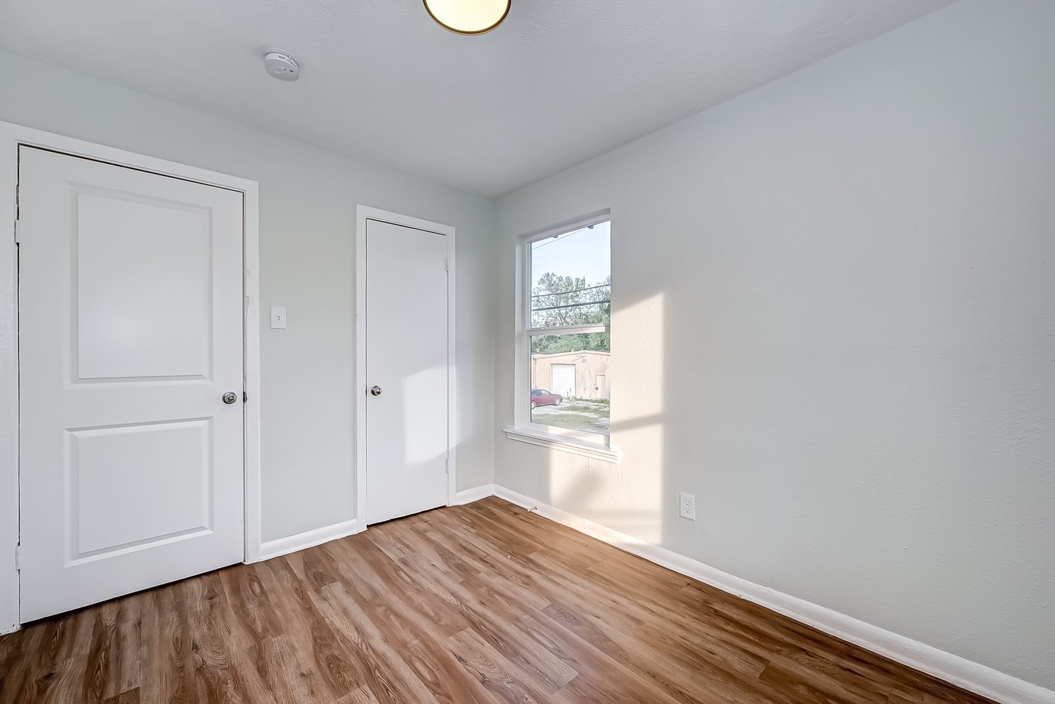 6420 Conley Street, Unit 4 Houston, TX 77021 - Photo 18 of 27 a view of empty room with wooden floor and fan